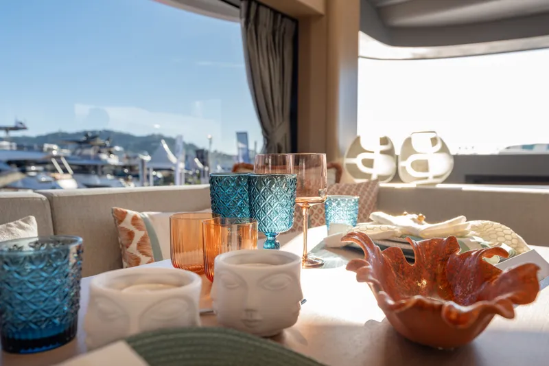 Slide: The Image of Elegant interior of the Sirena 48 with stylish glassware and decorations. - 26