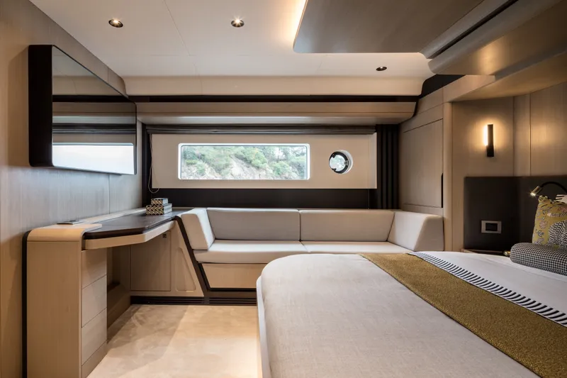 Slide: The Image of Luxurious interior of 2027 Sirena 48 yacht with modern furnishings and large window. - 27