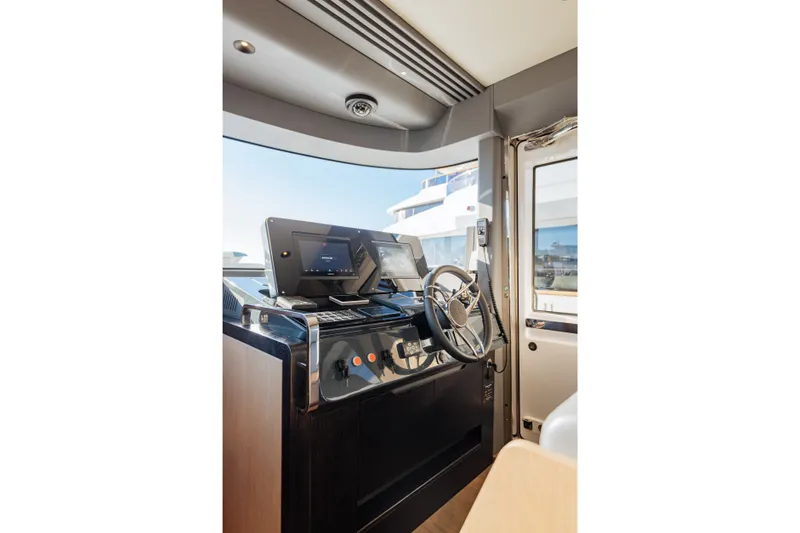 Slide: The Image of Modern helm station of 2027 Sirena 48 yacht with advanced navigation controls. - 23