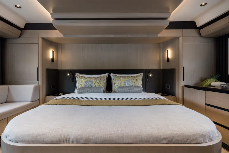 Slide: The Image of Luxurious Sirena 48 yacht bedroom interior, featuring modern design and elegant lighting, 2027 model. - 26