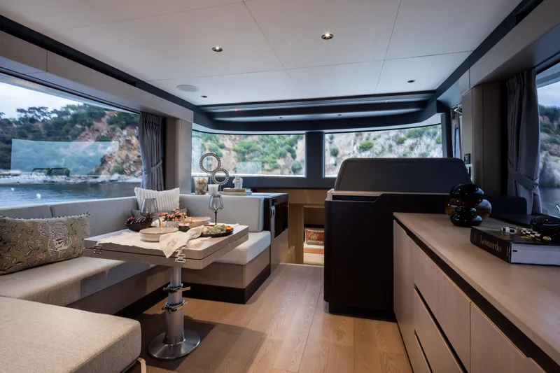 Slide: The Image of Luxurious interior of 2027 Sirena 48 yacht with elegant dining area and scenic views. - 23