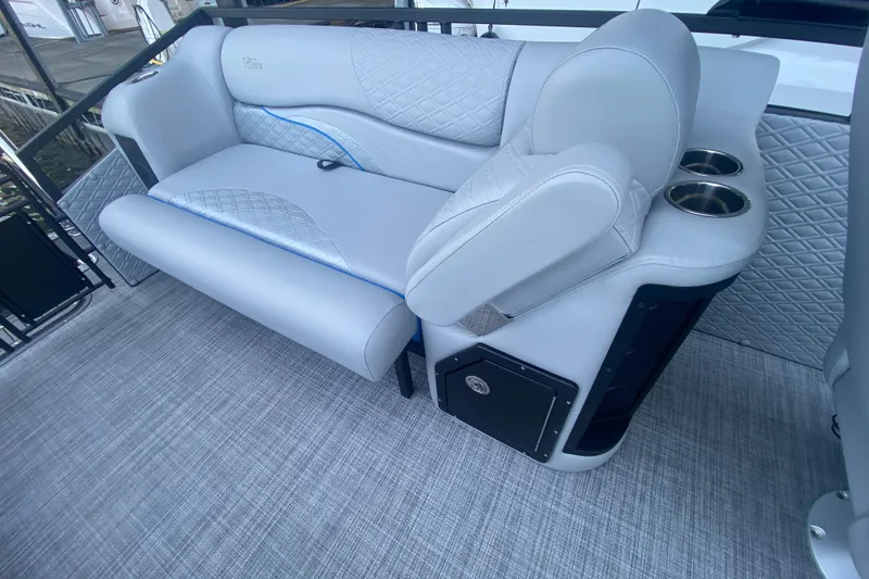 Slide: The Image of Luxurious seating on 2025 JC Sporttoon 26TT boat with quilted upholstery and cup holders. - 11