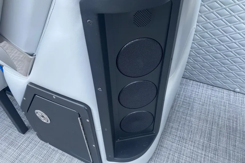 Slide: The Image of Interior of 2025 JC Sporttoon 26TT featuring sleek speaker system and quilted upholstery. - 12