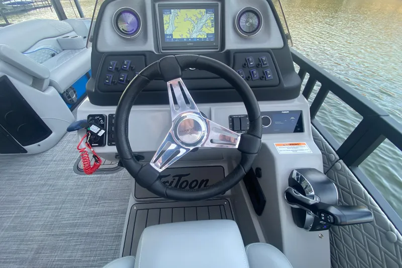 Slide: The Image of Steering console of 2025 JC Sporttoon 26TT boat with navigation display. - 17