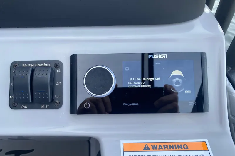Slide: The Image of Dashboard of JC Sporttoon 26TT 2025 with audio controls and warning label. - 18