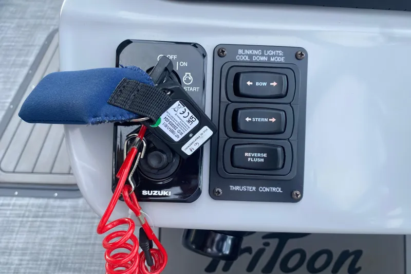 Slide: The Image of Control panel of a 2025 JC Sporttoon 26TT boat with Suzuki ignition and thruster controls. - 19