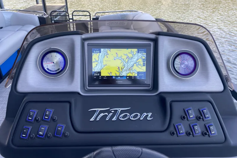 Slide: The Image of Dashboard of 2025 JC Sporttoon 26TT boat with navigation display and controls. - 20