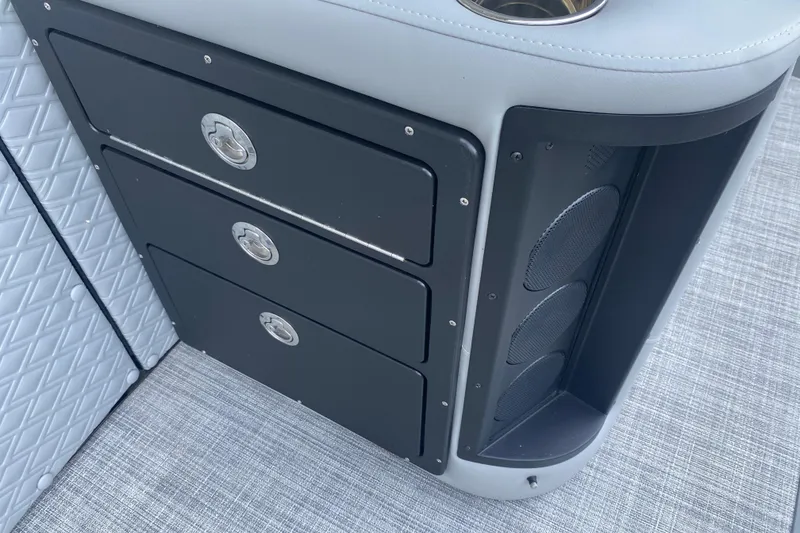 Slide: The Image of Storage drawers and speaker system on 2025 JC Sporttoon 26TT boat. - 27