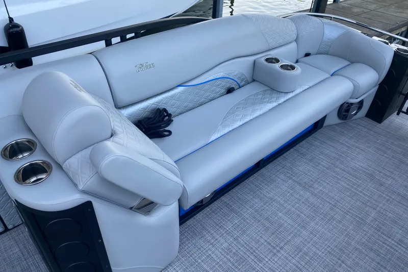 Slide: The Image of Luxurious seating on 2025 JC Sporttoon 26TT boat with cup holders and elegant design. - 29