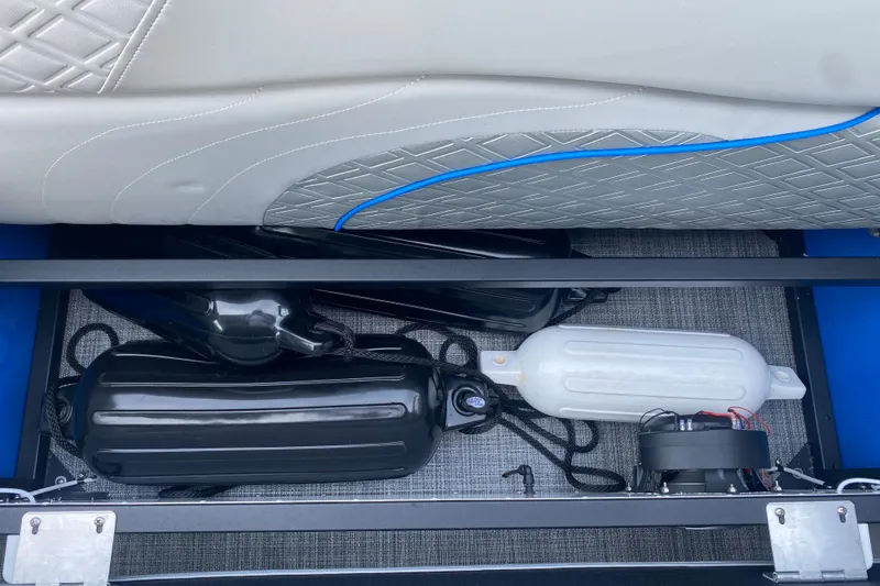 Slide: The Image of Storage compartment of 2025 JC Sporttoon 26TT boat with fenders and equipment. - 32