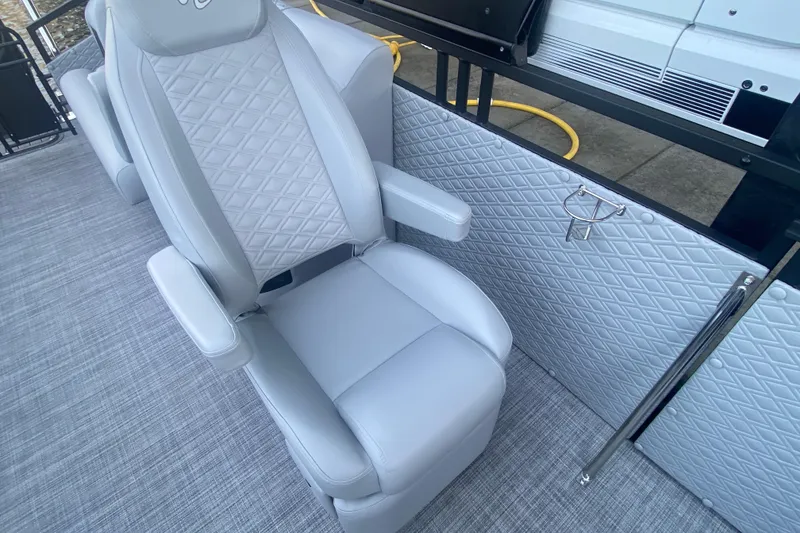 Slide: The Image of Luxurious seating on 2025 JC Sporttoon 26TT boat with quilted upholstery and armrests. - 36