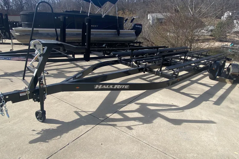 Slide: The Image of Trailer for JC Sporttoon 26TT 2025 model, parked outdoors on concrete surface. - 40