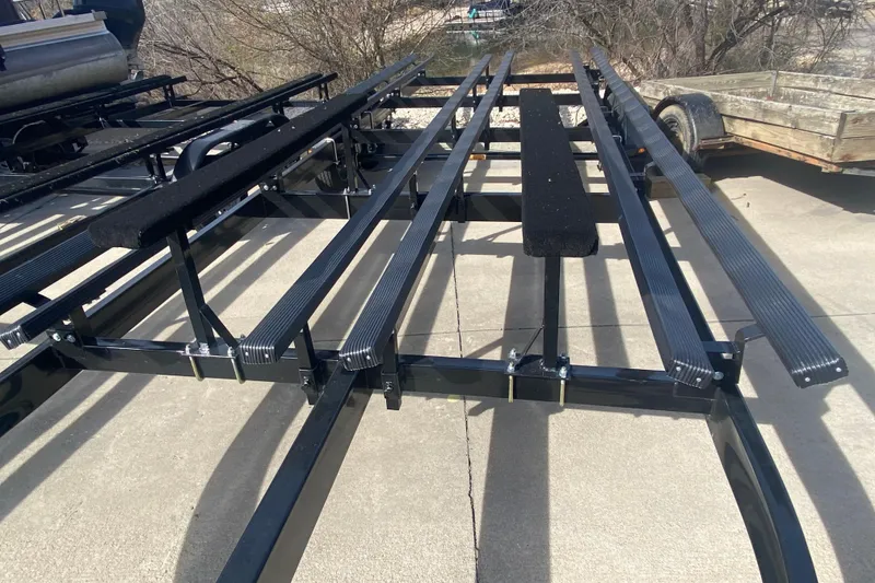 Slide: The Image of Trailer frame for JC Sporttoon 26TT, 2025 model, on concrete surface. - 41