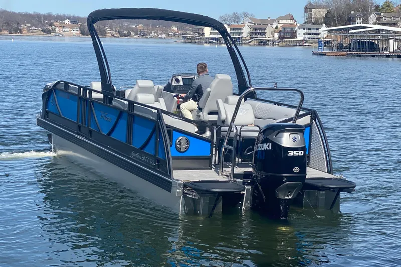 Slide: The Image of 2025 JC Sporttoon 26TT pontoon boat with Suzuki 350 engine on a lake. - 5