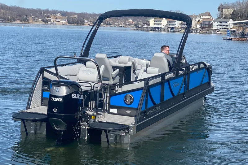 Slide: The Image of 2025 JC Sporttoon 26TT pontoon boat on a lake with Suzuki 350 engine. - 6