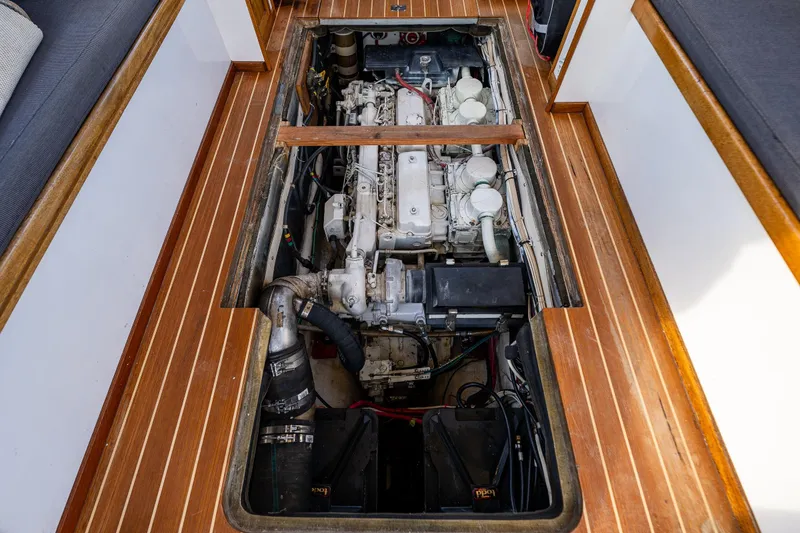 Slide: The Image of Engine compartment of a 1999 Northern Bay 36 boat, showcasing detailed mechanical components. - 13