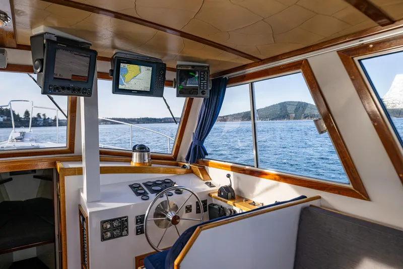 Slide: The Image of Interior view of a 1999 Northern Bay 36 boat cockpit with navigation equipment. - 16