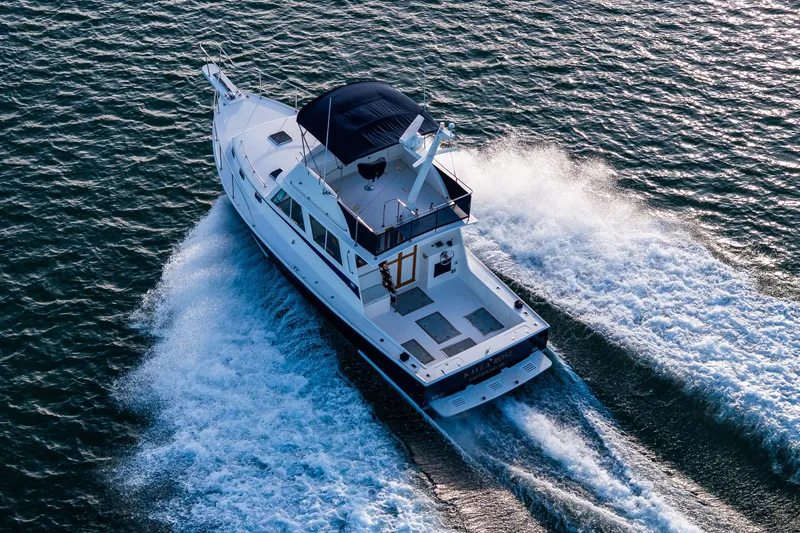 Slide: The Image of Aerial view of 1999 Northern Bay 36 yacht cruising on open water. - 4