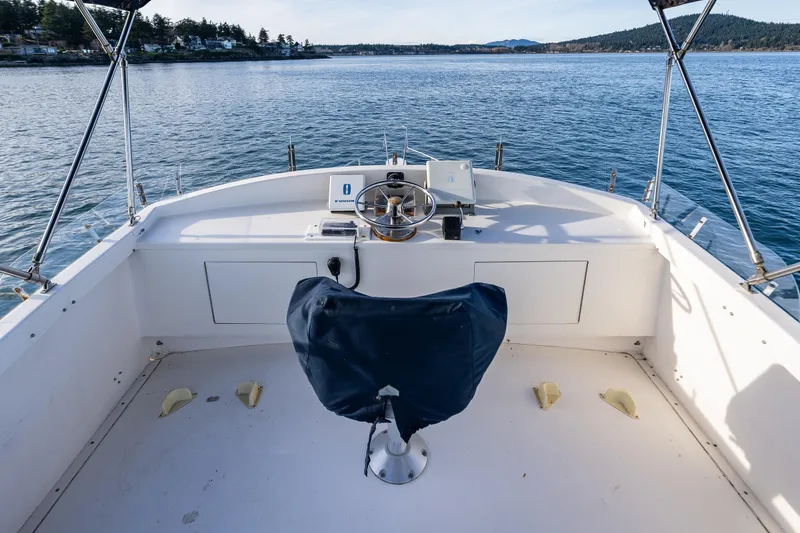Slide: The Image of Cockpit of 1999 Northern Bay 36 boat with steering wheel and navigation equipment. - 9