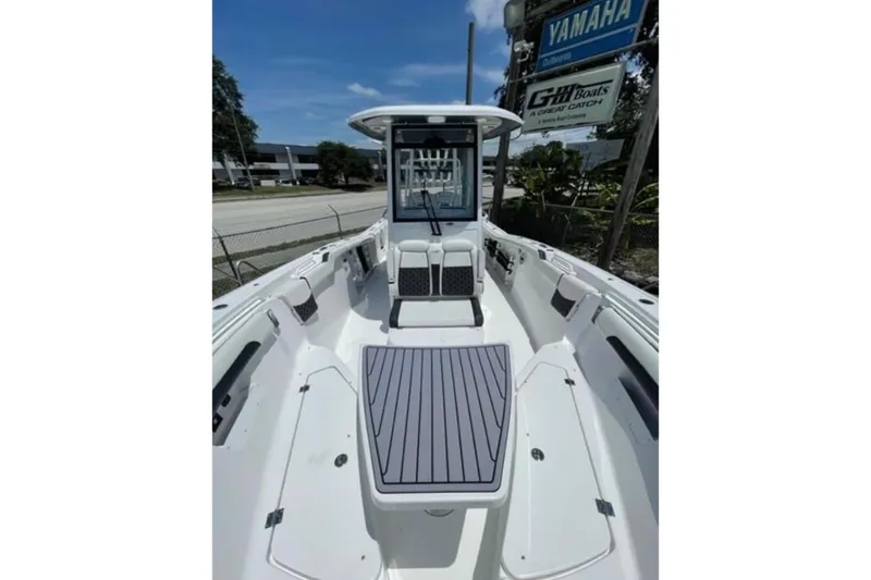 Slide: The Image of 2023 Tidewater 292 CC Adventure boat interior with seating and storage compartments. - 12