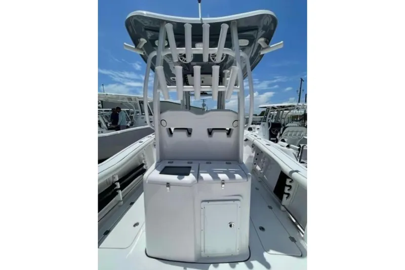 Slide: The Image of 2023 Tidewater 292 CC Adventure boat interior with rod holders and storage compartments. - 9