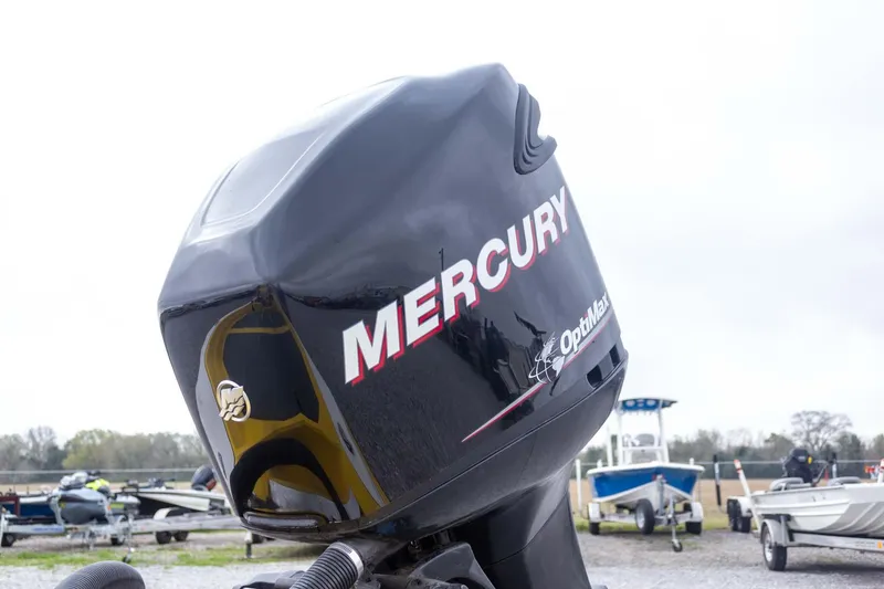 Slide: The Image of Outboard motor on a 2002 Bullet 20XDC boat, featuring Mercury branding. - 12