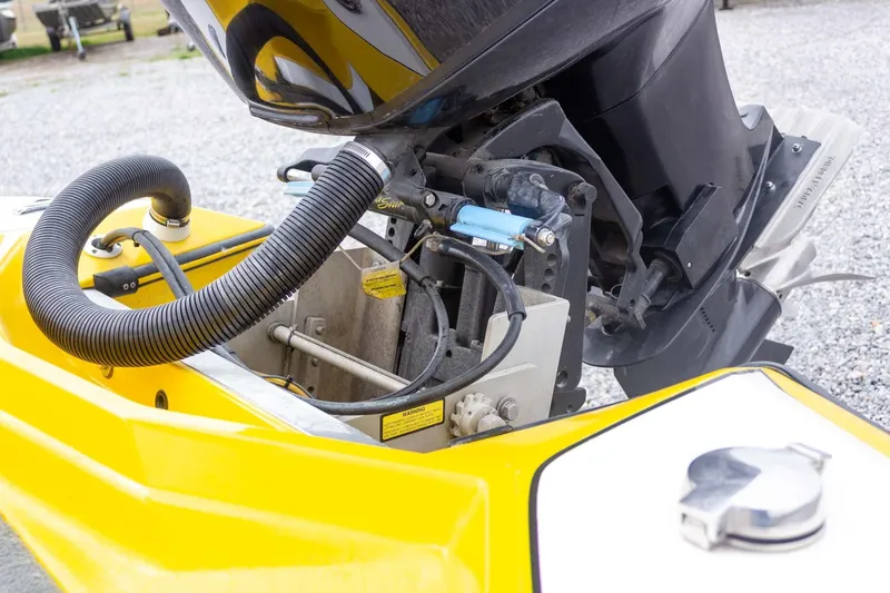 Slide: The Image of Yellow 2002 Bullet 20XDC boat engine detail with hoses and components. - 13