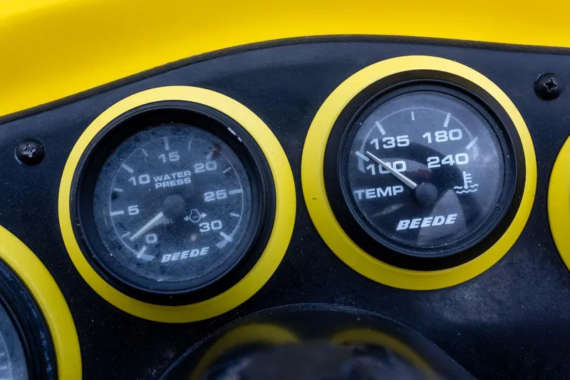 Slide: The Image of Close-up of 2002 Bullet 20XDC dashboard gauges showing water pressure and temperature. - 23