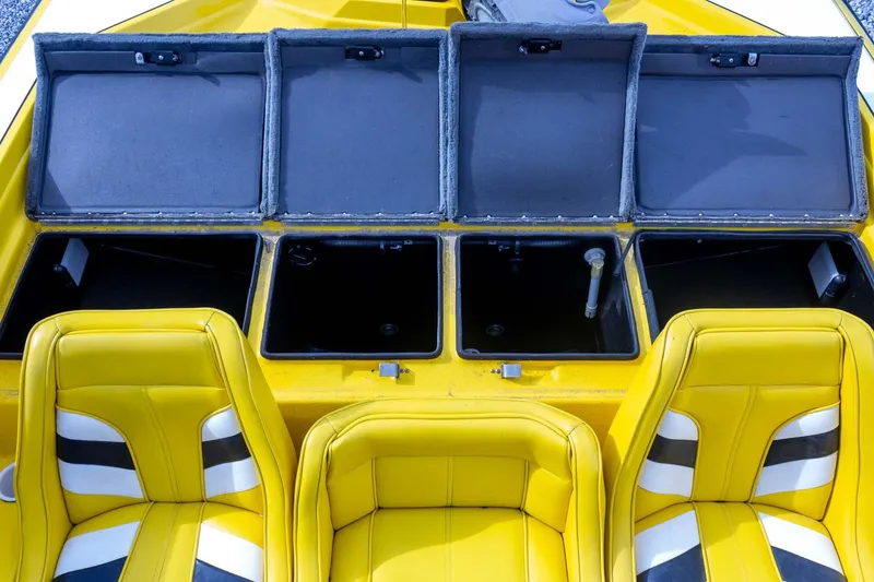 Slide: The Image of Yellow Bullet 20XDC boat interior with open storage compartments, 2002 model. - 27