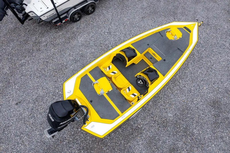 Slide: The Image of Yellow 2002 Bullet 20XDC boat with Mercury engine, viewed from above on gravel. - 38