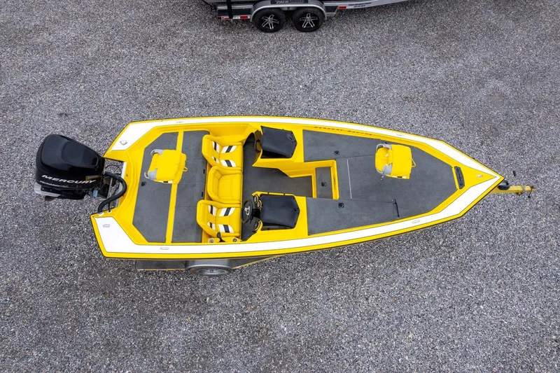 Slide: The Image of Yellow 2002 Bullet 20XDC boat with Mercury engine, aerial view on gravel surface. - 39