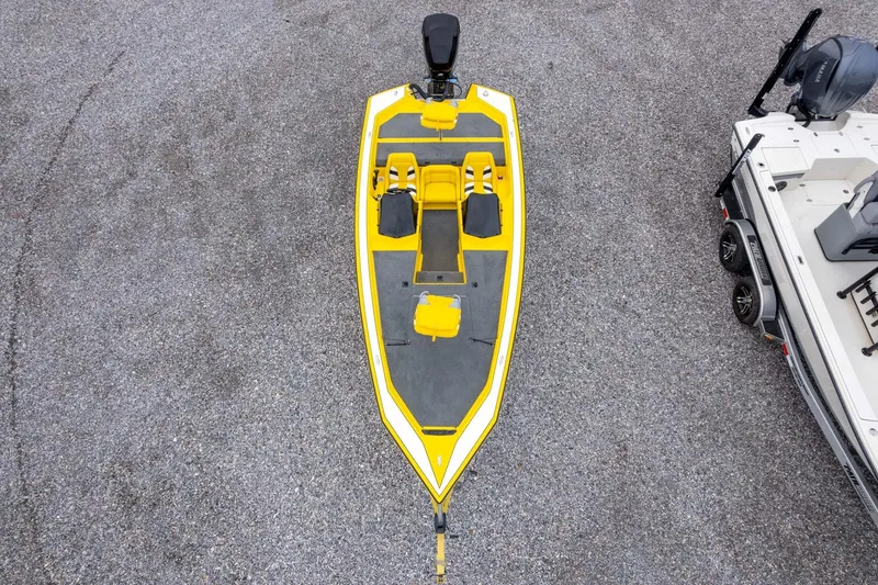 Slide: The Image of Yellow and gray 2002 Bullet 20XDC boat on gravel surface, aerial view. - 41
