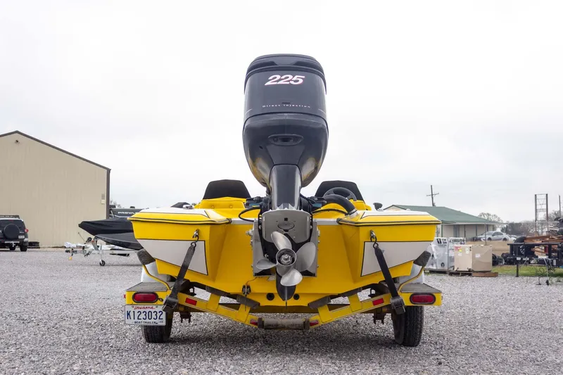 Slide: The Image of Yellow 2002 Bullet 20XDC boat with powerful outboard motor on trailer. - 8