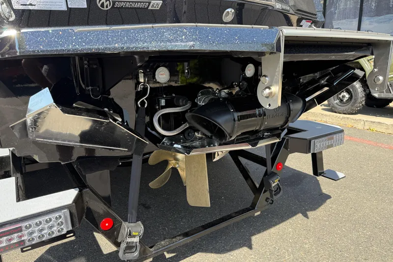 Slide: The Image of Rear view of 2026 MasterCraft X24 boat showcasing propeller and engine components. - 11