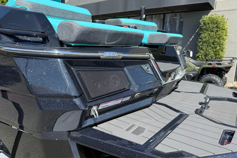 Slide: The Image of 2026 MasterCraft X24 boat with teal and gray seating, sleek design, and modern features. - 14