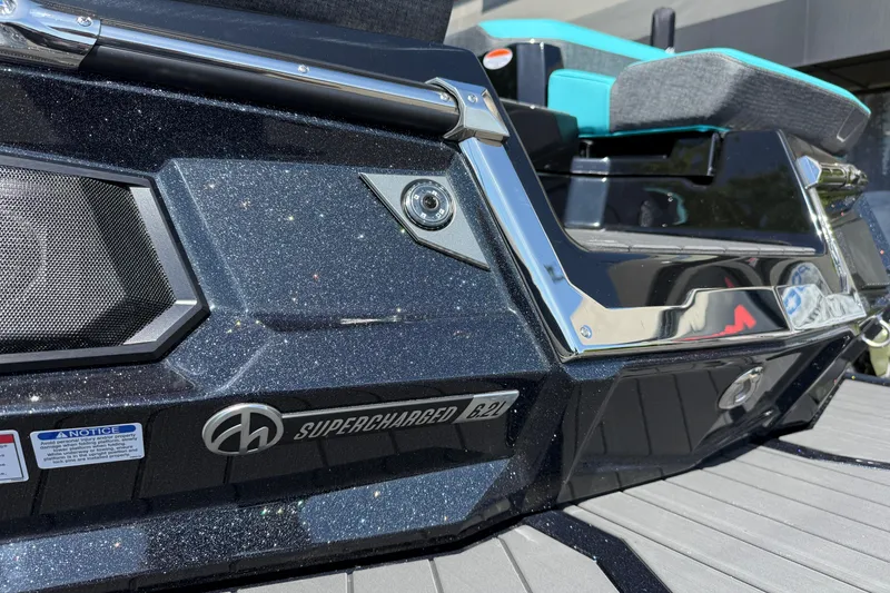 Slide: The Image of 2026 MasterCraft X24 boat with supercharged engine, sleek design, and modern features. - 15