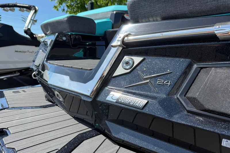 Slide: The Image of 2026 MasterCraft X24 boat with SurfStar feature, close-up view of rear deck. - 16