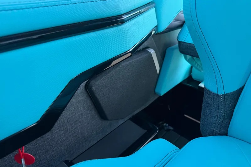 Slide: The Image of 2026 MasterCraft X24 interior with vibrant blue upholstery and sleek design elements. - 32