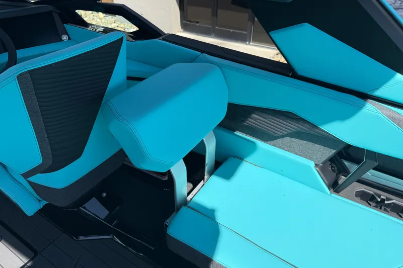 Slide: The Image of 2026 MasterCraft X24 interior with vibrant turquoise seating and modern design elements. - 33