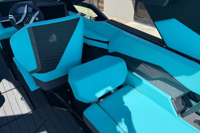 Slide: The Image of 2026 MasterCraft X24 boat interior with turquoise seating and modern design. - 34