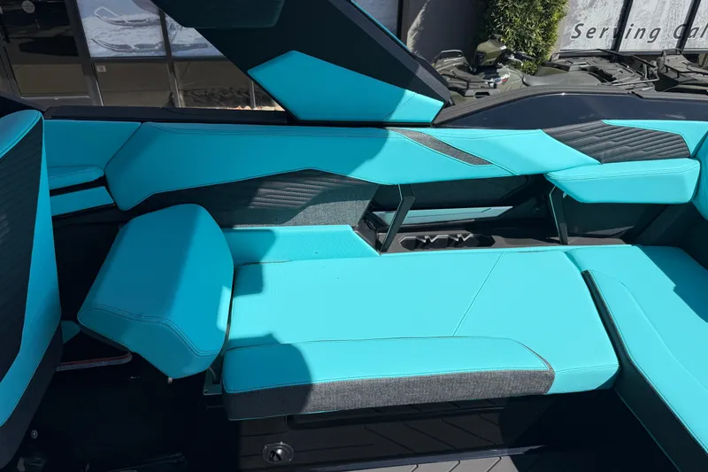 Slide: The Image of 2026 MasterCraft X24 boat interior with turquoise seating and modern design. - 35