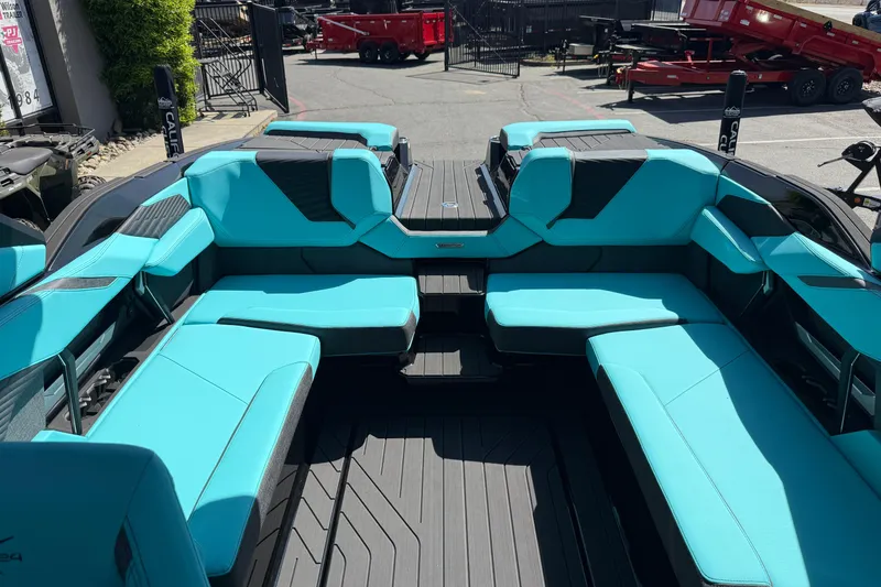 Slide: The Image of 2026 MasterCraft X24 boat interior with turquoise seating and sleek design. - 37