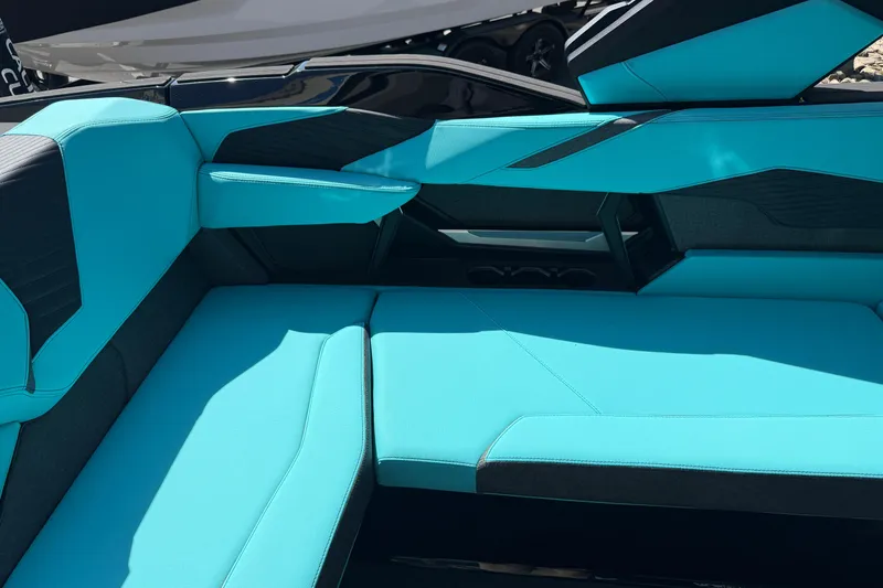 Slide: The Image of 2026 MasterCraft X24 boat interior with sleek turquoise seating design. - 39
