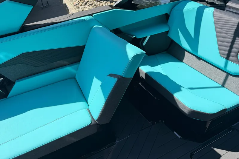 Slide: The Image of 2026 MasterCraft X24 boat interior with turquoise and gray seating. - 41