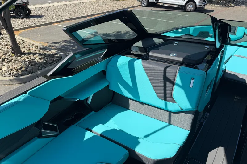 Slide: The Image of 2026 MasterCraft X24 boat interior with turquoise seating and modern design. - 42