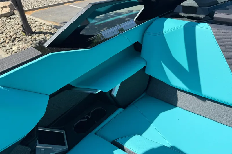 Slide: The Image of Interior of 2026 MasterCraft X24 boat with turquoise seating and modern design. - 44