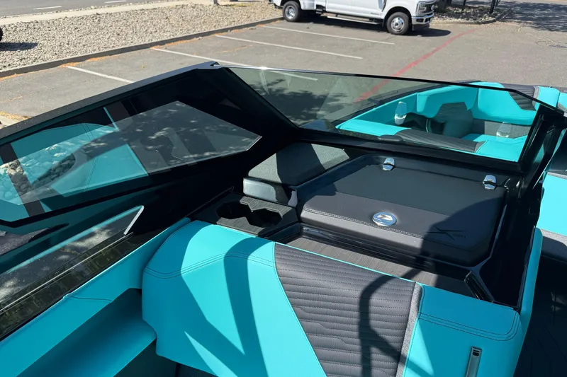 Slide: The Image of 2026 MasterCraft X24 boat interior with turquoise seating and sleek design. - 45