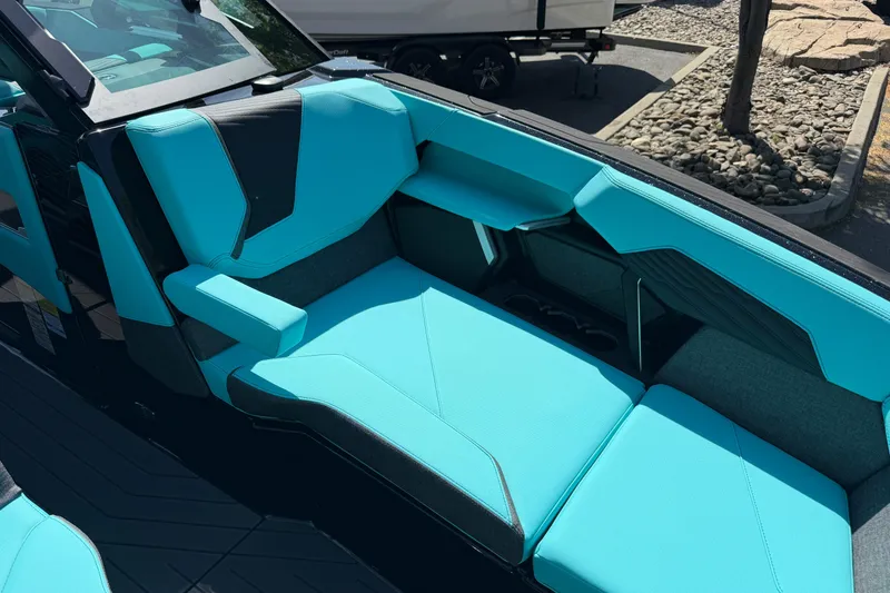 Slide: The Image of 2026 MasterCraft X24 boat interior with turquoise seating and sleek design. - 50