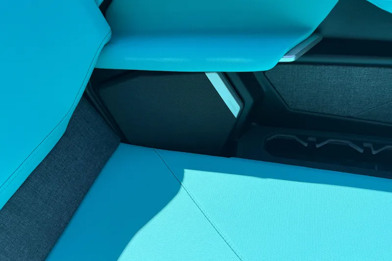 Slide: The Image of 2026 MasterCraft X24 interior with vibrant blue upholstery and sleek design elements. - 52