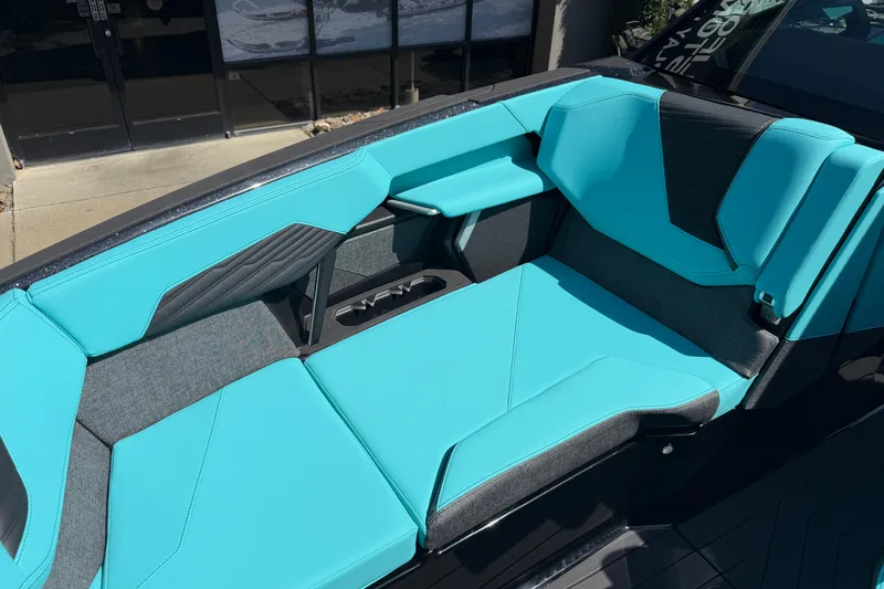 Slide: The Image of 2026 MasterCraft X24 boat interior with turquoise and gray seating. - 56